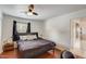 This bedroom offers a minimalist design, natural light, and wood-style flooring at 2217 N 37Th Pl, Phoenix, AZ 85008