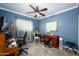 Comfortable bedroom with a ceiling fan, neutral walls, and ample workspace at 2217 N 37Th Pl, Phoenix, AZ 85008