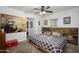 Stylish bedroom with a unique wooden bed frame, herringbone floors, and artistic decor at 2217 N 37Th Pl, Phoenix, AZ 85008