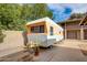 This is the back yard of a renovated vintage camper home at 2217 N 37Th Pl, Phoenix, AZ 85008