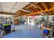 Expansive garage features overhead lighting, storage shelves, an epoxy-coated floor, and abundant workspace at 2217 N 37Th Pl, Phoenix, AZ 85008