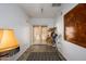 Bright hallway with French doors leading outside, and a wooden art piece at 2217 N 37Th Pl, Phoenix, AZ 85008