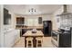 Well-lit kitchen featuring dark cabinetry, butcher block island, and modern appliances at 2217 N 37Th Pl, Phoenix, AZ 85008