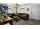 Inviting living room with modern decor, a ceiling fan, and stylish herringbone flooring at 2217 N 37Th Pl, Phoenix, AZ 85008