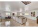 Open-concept living room with tile floors, white walls, and a comfortable sectional sofa at 2217 N 37Th Pl, Phoenix, AZ 85008