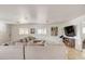 Spacious living room featuring a large sectional sofa and windows providing natural light at 2217 N 37Th Pl, Phoenix, AZ 85008