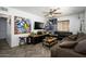 Cozy living room with stylish decor, a ceiling fan, and herringbone wood floors at 2217 N 37Th Pl, Phoenix, AZ 85008