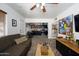 Bright living area with modern decor, opening into a kitchen with sleek black cabinetry at 2217 N 37Th Pl, Phoenix, AZ 85008