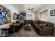 Cozy living room with stylish decor, a ceiling fan, and herringbone wood floors at 2217 N 37Th Pl, Phoenix, AZ 85008