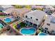 Backyard aerial view showcases an outdoor entertainment area with a pool, patio, and landscaped yard at 23510 N 25Th St, Phoenix, AZ 85024