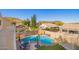 Inviting backyard featuring a sparkling pool, lush landscaping, and privacy fence at 23510 N 25Th St, Phoenix, AZ 85024