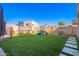 Beautifully maintained backyard with lush artificial turf and recreational features at 23510 N 25Th St, Phoenix, AZ 85024