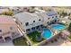 Aerial view of the backyard featuring a pool, lush grass, patio, and outdoor entertaining space at 23510 N 25Th St, Phoenix, AZ 85024