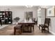 Dining room showcases a dark wood table, modern chandelier, and an abundance of natural light at 23510 N 25Th St, Phoenix, AZ 85024