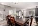 Open-concept dining room is filled with natural light and is adjacent to the entryway and living room at 23510 N 25Th St, Phoenix, AZ 85024