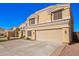 A beautiful two-story home boasts desert landscaping and a three-car garage at 23510 N 25Th St, Phoenix, AZ 85024