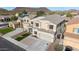 Inviting two-story home with a well-maintained lawn, concrete driveway, and tasteful exterior color scheme at 23510 N 25Th St, Phoenix, AZ 85024