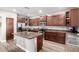 Well-lit kitchen with stainless steel appliances and a functional kitchen island at 23510 N 25Th St, Phoenix, AZ 85024