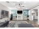 Cozy living room featuring a ceiling fan, fireplace, and stylish blue accent wall at 23510 N 25Th St, Phoenix, AZ 85024