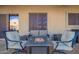 Backyard patio with comfortable seating around fire table and wine at 23510 N 25Th St, Phoenix, AZ 85024