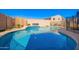 Sparkling blue pool with decorative tile and mature foliage at 23510 N 25Th St, Phoenix, AZ 85024