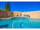 Stunning backyard pool with integrated waterfall feature and mature landscaping at 23510 N 25Th St, Phoenix, AZ 85024