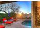 A stunning backyard with a pool, lounge chairs, and lush landscaping creates a relaxing outdoor oasis at 24024 N 74Th St, Scottsdale, AZ 85255