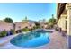 A luxurious pool and spa area with tile accents, surrounded by lush landscaping and a private patio at 24024 N 74Th St, Scottsdale, AZ 85255