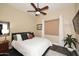 Cozy bedroom with a decorative ceiling fan, a large bed, and neutral color accents at 24024 N 74Th St, Scottsdale, AZ 85255