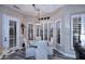 Charming breakfast nook with a round table, upholstered chairs, and plantation shutters for natural light at 24024 N 74Th St, Scottsdale, AZ 85255