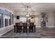 Inviting dining room features a rustic wood table with seating for six and modern overhead lighting at 24024 N 74Th St, Scottsdale, AZ 85255