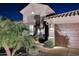 Well-lit home exterior showcasing a manicured front yard, tile roof, and attached garage at 24024 N 74Th St, Scottsdale, AZ 85255