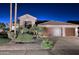 Charming single-story home boasting a three-car garage, desert landscaping, and a tile roof at 24024 N 74Th St, Scottsdale, AZ 85255