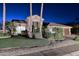 Charming single-story home featuring desert landscaping, manicured grass, and a tile roof at 24024 N 74Th St, Scottsdale, AZ 85255