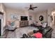 Comfortable living room with a decorative fireplace, wood-style flooring, and nautical accents at 24024 N 74Th St, Scottsdale, AZ 85255