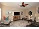 Comfortable living room with hardwood floors, ceiling fan, fireplace, and modern decor at 24024 N 74Th St, Scottsdale, AZ 85255