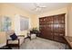 Inviting living room with a large bookcase, neutral-toned furniture, and a ceiling fan at 24024 N 74Th St, Scottsdale, AZ 85255