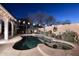 Inviting backyard pool and spa area perfect for relaxing and entertaining under the evening sky at 24024 N 74Th St, Scottsdale, AZ 85255