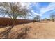 Large backyard with desert landscaping, block wall, and lots of room to add a pool at 28214 N 223Rd Ln, Wittmann, AZ 85361