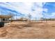 View of backyard area showing the home's exterior, landscaping, and potential for outdoor activities at 28214 N 223Rd Ln, Wittmann, AZ 85361