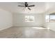 Bedroom with wood-look flooring offers lots of light and views of the landscape at 28214 N 223Rd Ln, Wittmann, AZ 85361