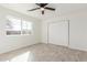 Bedroom featuring a large window and closet with modern flooring at 28214 N 223Rd Ln, Wittmann, AZ 85361