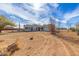 Desert home with light gray stucco walls, desert landscaping, and a two-car garage at 28214 N 223Rd Ln, Wittmann, AZ 85361