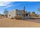 Gray home with desert landscaping, block architecture, and a fenced yard at 28214 N 223Rd Ln, Wittmann, AZ 85361