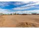 A view of the expansive lot showcasing its potential for various uses and future development at 28214 N 223Rd Ln, Wittmann, AZ 85361