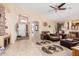 Inviting living room featuring tile flooring, neutral walls, and an open floor plan at 29247 N Bauxite Ln, San Tan Valley, AZ 85143