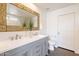 Bathroom features a dual sink vanity, neutral paint, and decorative mirror at 3043 W Melinda Ln, Phoenix, AZ 85027