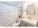 Hall bathroom featuring a shower-tub combo and decorative accents at 3043 W Melinda Ln, Phoenix, AZ 85027