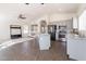 Open kitchen featuring gray cabinets, stainless steel appliances, granite counters and seamless flow to the living area at 3043 W Melinda Ln, Phoenix, AZ 85027