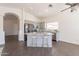 Bright open concept kitchen featuring granite countertops, stainless steel appliances, and an island with seating at 3043 W Melinda Ln, Phoenix, AZ 85027